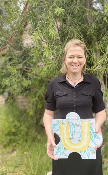 Sarah Southam with her beautifully painted puzzle piece. Sarah has enjoyed her time with the Murrindindi Shire Council during COVID-19 and the blue gums with their stunning eucalypt perfume.